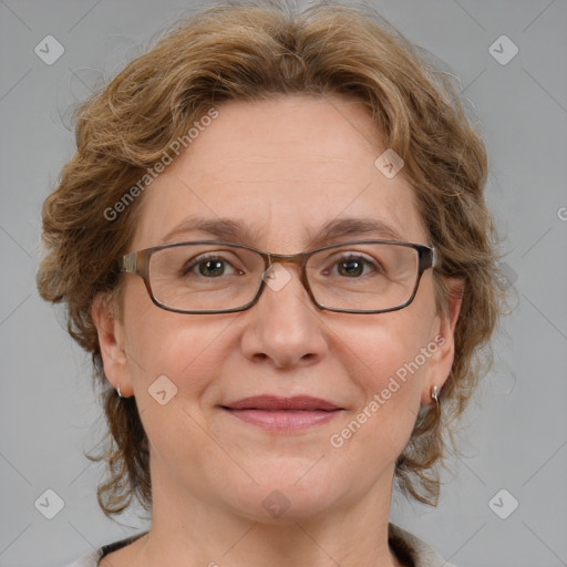 Joyful white adult female with medium  brown hair and blue eyes