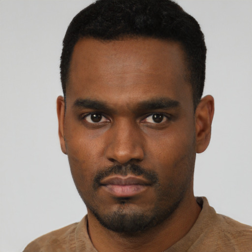 Neutral black young-adult male with short  black hair and brown eyes