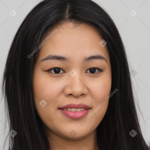 Joyful asian young-adult female with long  brown hair and brown eyes