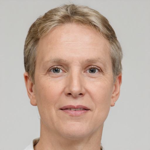 Joyful white adult female with short  brown hair and grey eyes