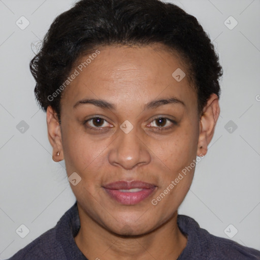 Joyful latino adult female with short  brown hair and brown eyes