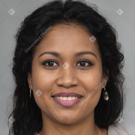 Joyful black young-adult female with long  brown hair and brown eyes