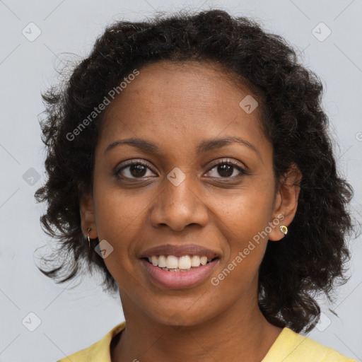 Joyful black young-adult female with medium  brown hair and brown eyes