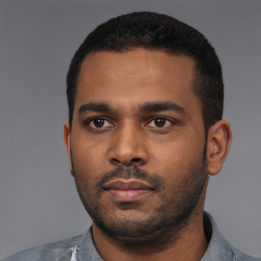 Neutral black young-adult male with short  black hair and brown eyes