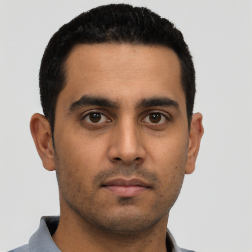Neutral latino young-adult male with short  black hair and brown eyes