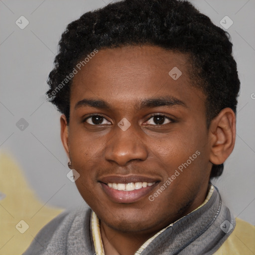 Joyful black young-adult male with short  brown hair and brown eyes