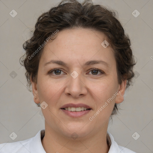 Joyful white adult female with short  brown hair and brown eyes