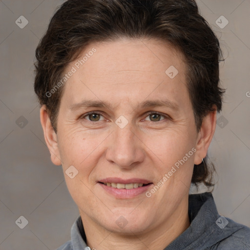 Joyful white adult female with short  brown hair and brown eyes