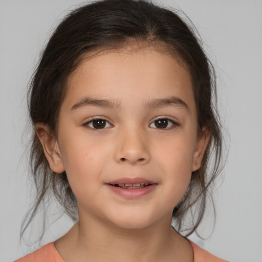 Joyful white child female with medium  brown hair and brown eyes