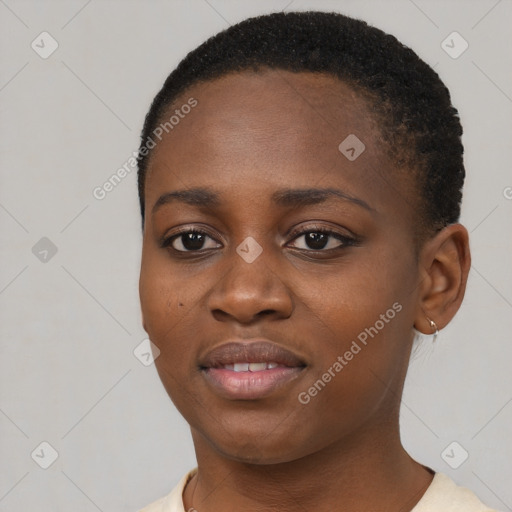 Joyful black young-adult female with short  black hair and brown eyes