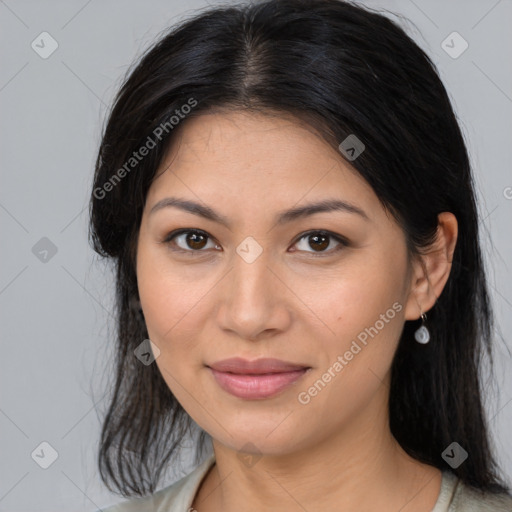 Joyful latino young-adult female with medium  brown hair and brown eyes