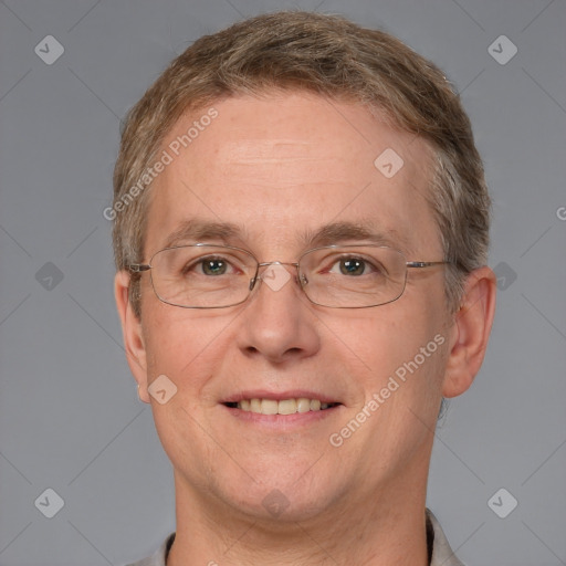 Joyful white adult male with short  brown hair and grey eyes