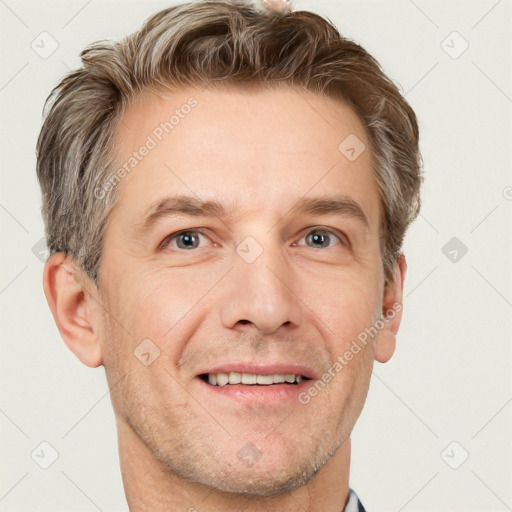 Joyful white adult male with short  brown hair and grey eyes