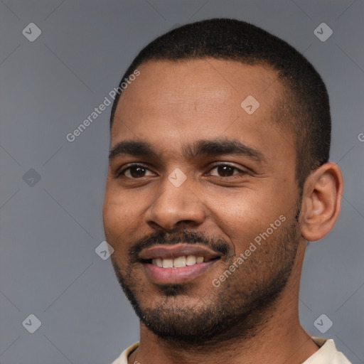 Joyful black young-adult male with short  black hair and brown eyes