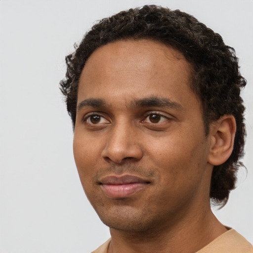 Neutral black young-adult male with short  brown hair and brown eyes