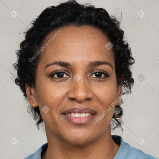 Joyful black adult female with short  brown hair and brown eyes