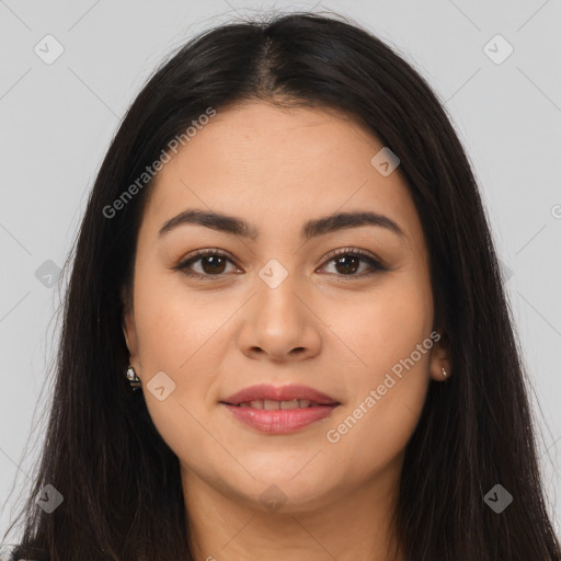 Joyful latino young-adult female with long  brown hair and brown eyes