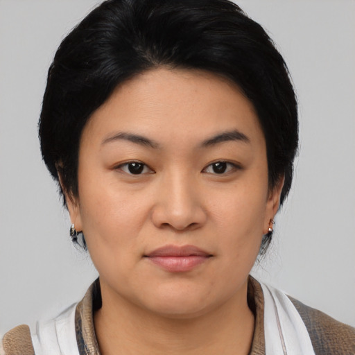 Joyful asian young-adult female with medium  black hair and brown eyes