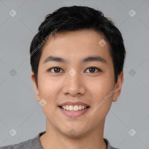 Joyful asian young-adult male with short  black hair and brown eyes