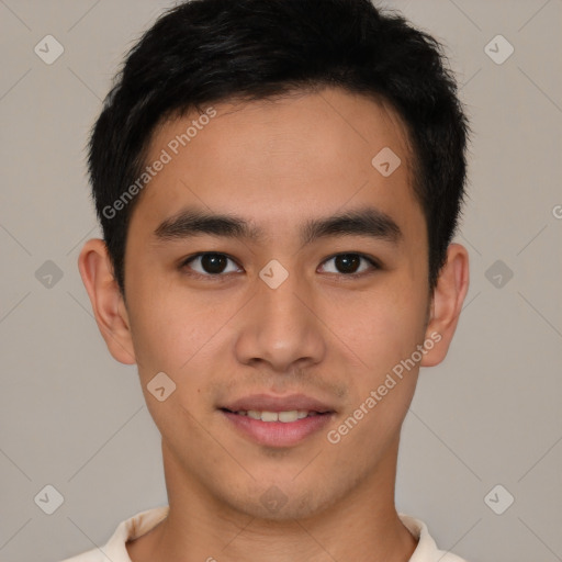 Joyful latino young-adult male with short  brown hair and brown eyes