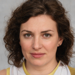 Joyful white young-adult female with medium  brown hair and green eyes