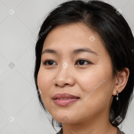 Joyful asian young-adult female with medium  brown hair and brown eyes