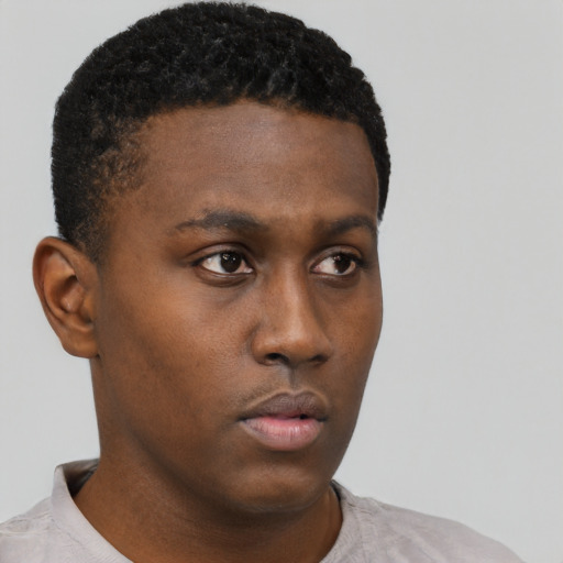 Neutral black young-adult male with short  brown hair and brown eyes