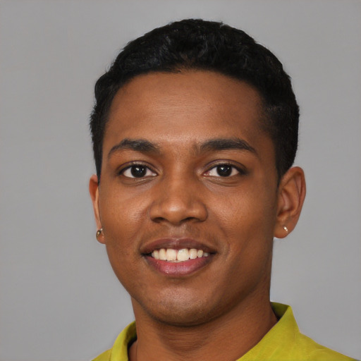 Joyful black young-adult male with short  black hair and brown eyes