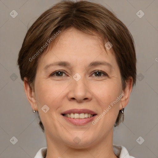 Joyful white adult female with short  brown hair and brown eyes