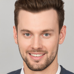 Joyful white young-adult male with short  brown hair and brown eyes