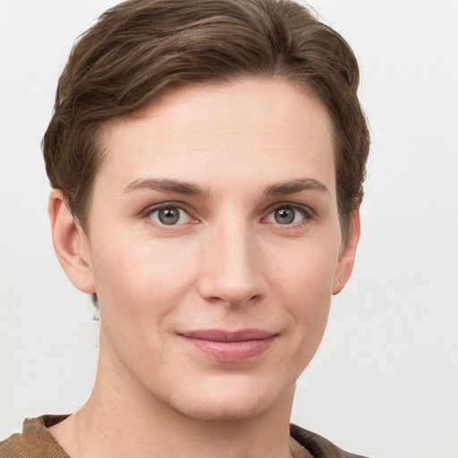 Joyful white young-adult female with short  brown hair and grey eyes