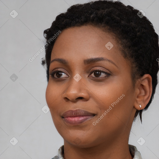 Joyful black young-adult female with medium  black hair and brown eyes