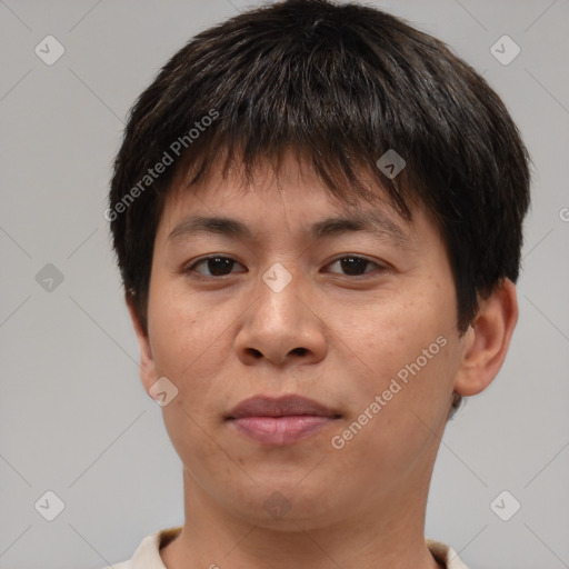 Joyful asian young-adult male with short  brown hair and brown eyes