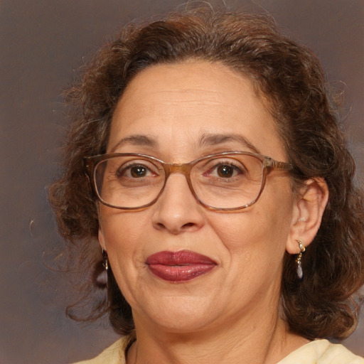 Joyful white middle-aged female with medium  brown hair and brown eyes