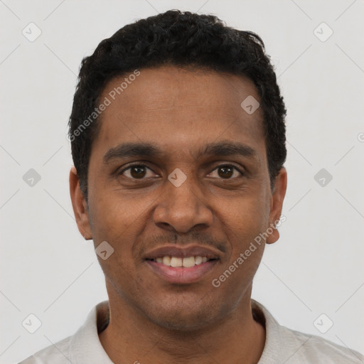 Joyful black young-adult male with short  black hair and brown eyes