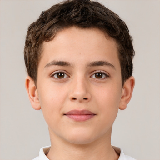 Joyful white child male with short  brown hair and brown eyes