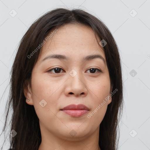 Joyful asian young-adult female with long  brown hair and brown eyes