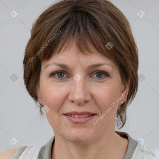 Joyful white adult female with medium  brown hair and grey eyes