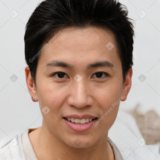 Joyful asian young-adult male with short  brown hair and brown eyes