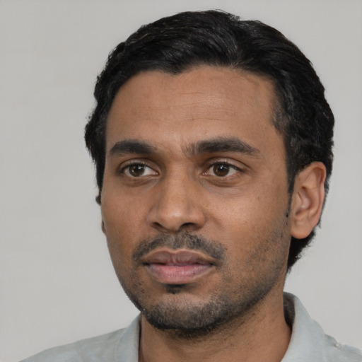 Neutral black young-adult male with short  black hair and brown eyes