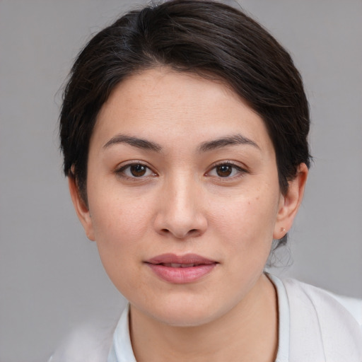 Joyful white young-adult female with medium  brown hair and brown eyes