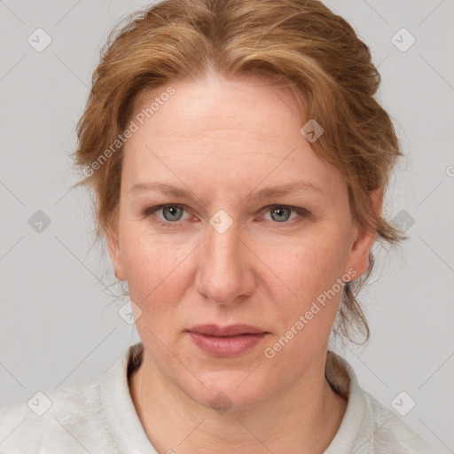 Joyful white adult female with medium  brown hair and blue eyes