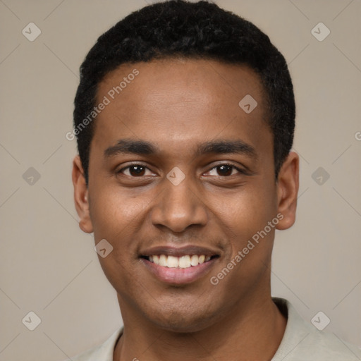 Joyful black young-adult male with short  black hair and brown eyes