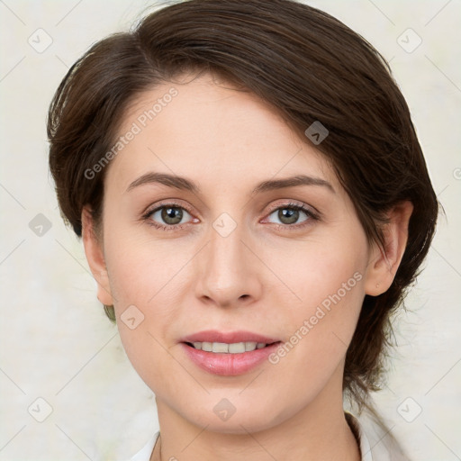 Joyful white young-adult female with medium  brown hair and green eyes