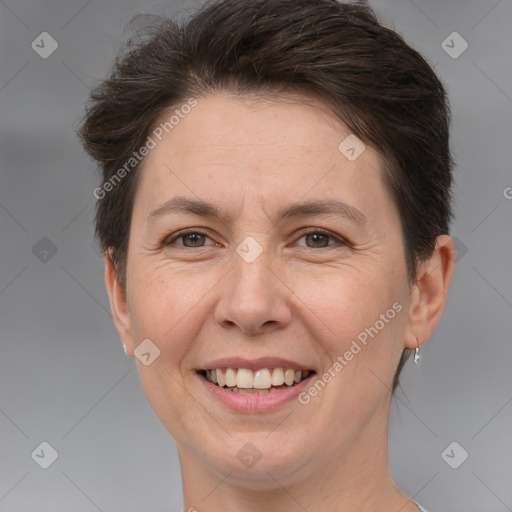 Joyful white adult female with short  brown hair and brown eyes