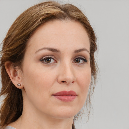 Joyful white young-adult female with medium  brown hair and brown eyes