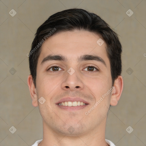 Joyful white young-adult male with short  black hair and brown eyes