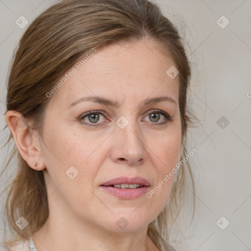 Joyful white adult female with medium  brown hair and grey eyes