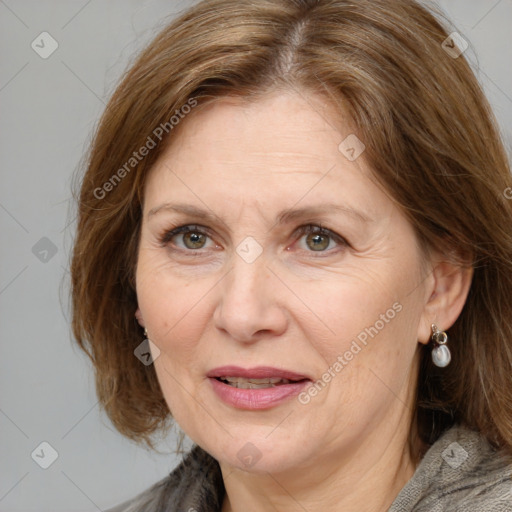 Joyful white adult female with medium  brown hair and blue eyes