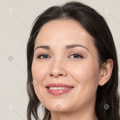 Joyful white young-adult female with medium  brown hair and brown eyes